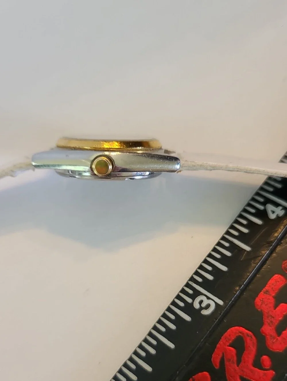 Seiko White Dial Watch with Gold Bezel and White Strap